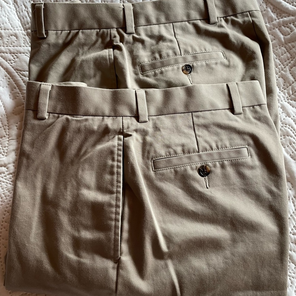 Two identical pairs of men’s pants.